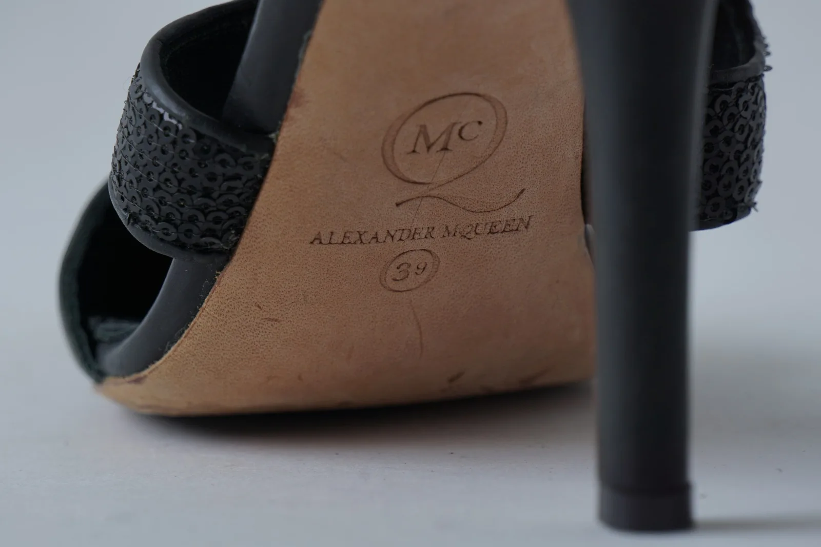 Close-up of the minuit leather sole showing the Alexander McQueen mark.