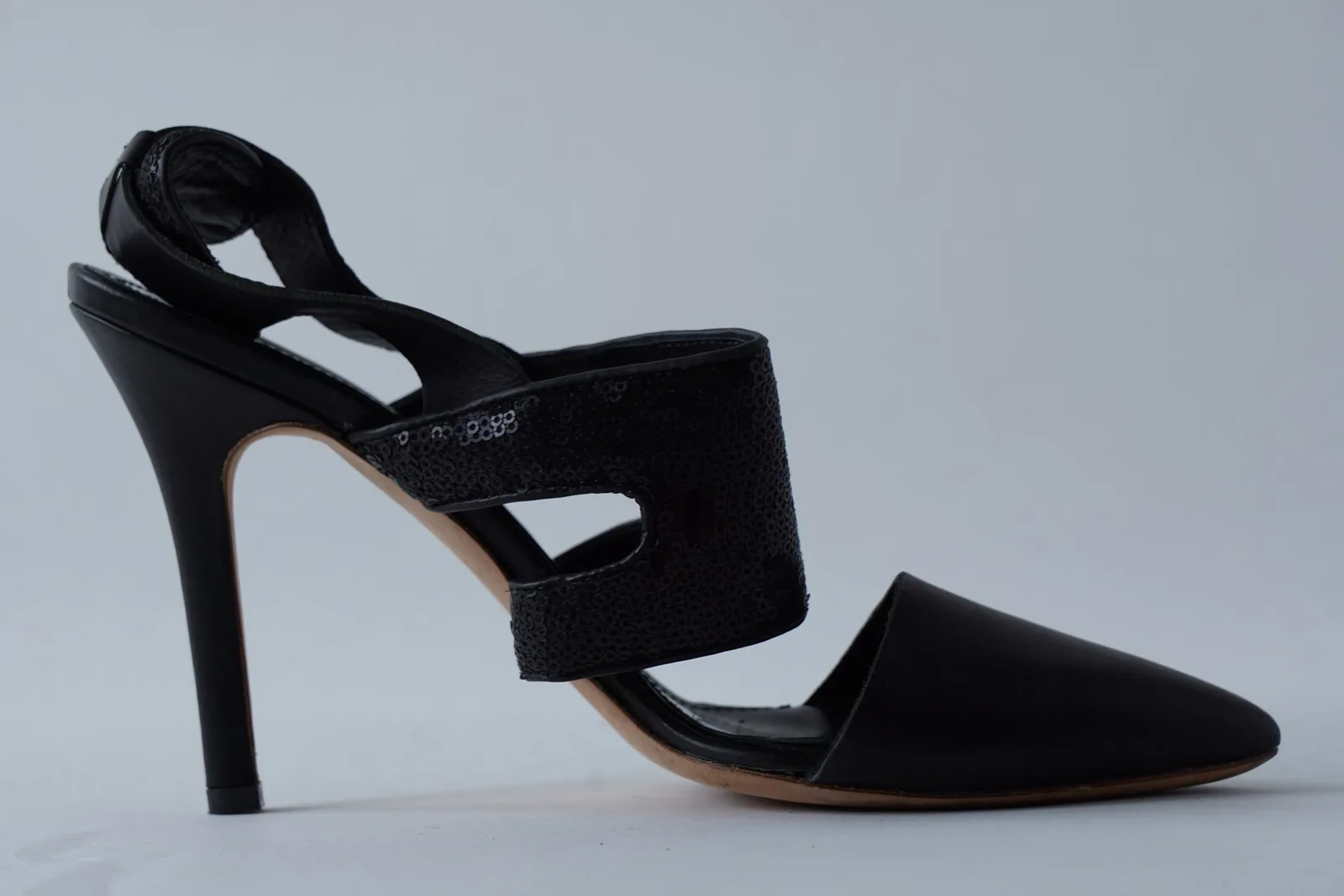 Close side view of the minuit stiletto and cutout sequin straps.